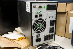 Professional UPS rental provider installing a backup power system for business operations